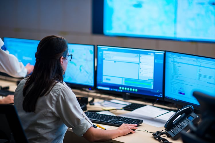 Woman operator working in a control room