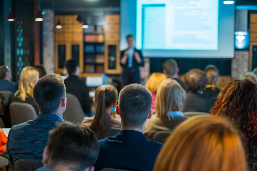 Audience listening to a speaker