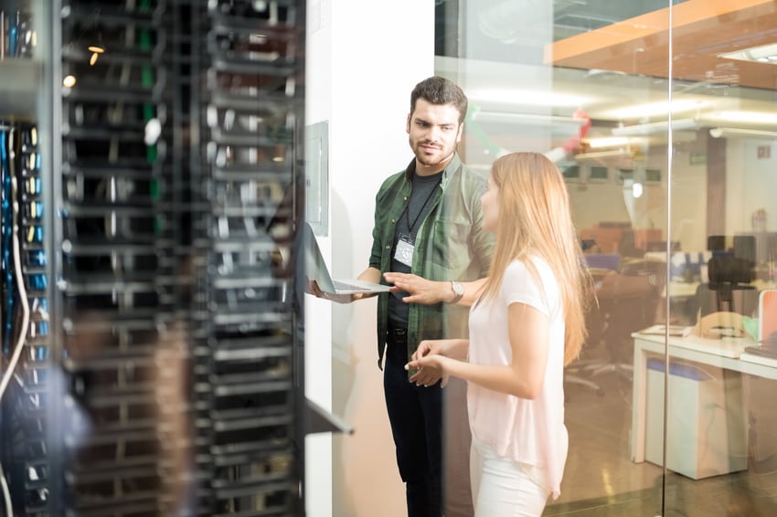 Man and Women looking at computer